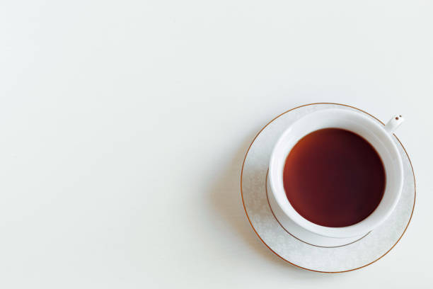 istock Tea in a cup on a white saucer 1253455973