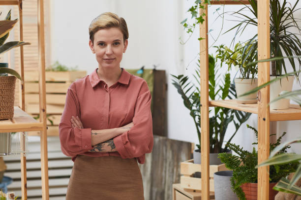istock Female Shop Owner Looking at Camera 1253456326