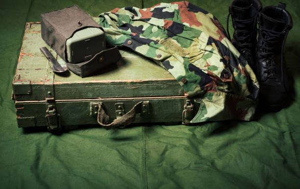 istock Vintage military boxes, army tent fabrics and accessories 1253456782