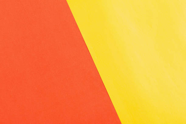 istock orange and yellow paper background 1253457204