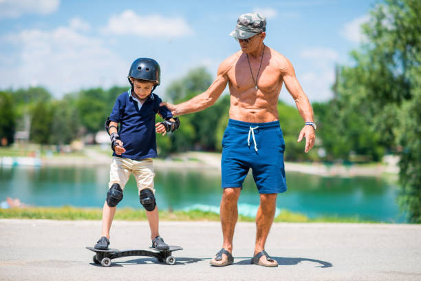 istock Full Length Of Boys On Water 1253457274