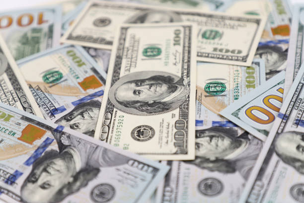 Hundred dollar bills, the foreground and background are blurred. Hundred dollar bills, the foreground and background are blurred. cash flow photos stock pictures, royalty-free photos & images