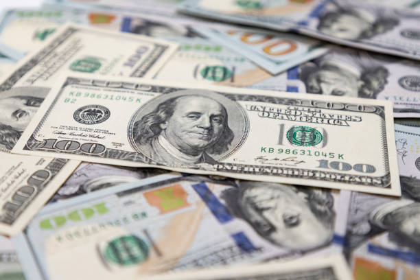 istock Hundred dollar bills, the foreground and background are blurred. 1253458204