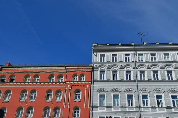 istock Moscow skyline with red and grey multi storey buildings with a deep blue sky 1253458214