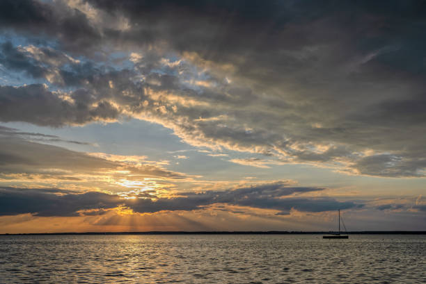 Majestic cloudscape at dusk over lake. Location: Lake Steinhuder Meer, Lower Saxony, Germany.