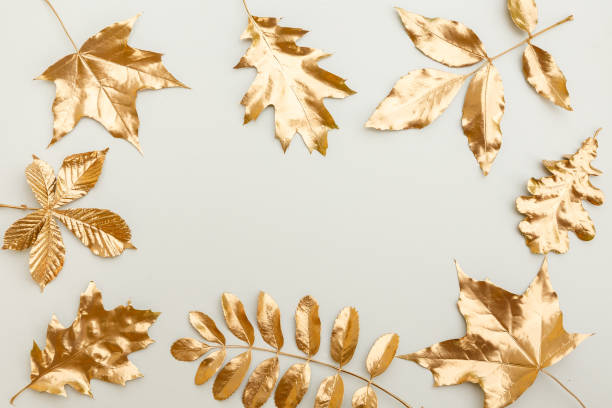 istock Frame of golden leaves. 1253458732