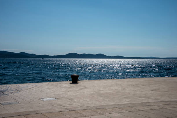 Several boats near shore of Omis, Croatia at a really bright day