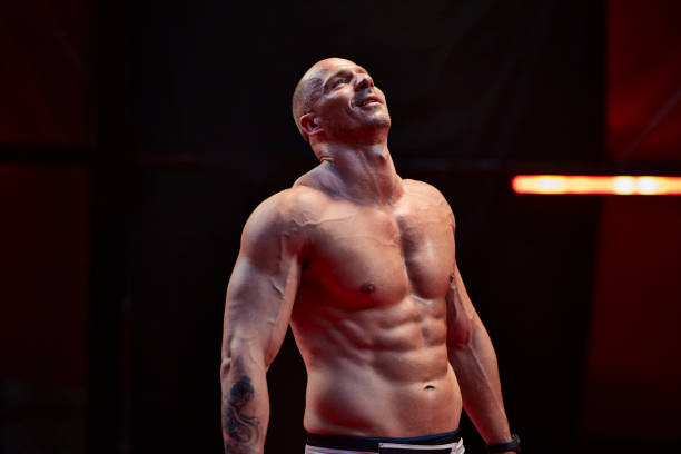 Man on a fighting ring. Defeated and sad