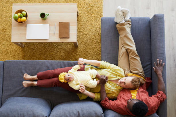 istock Family sitting at home 1253459939