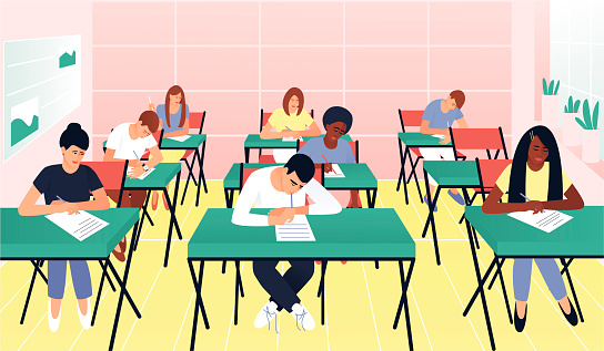 Students write a test exam in a beautiful classroom