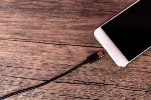 istock Mobile phone connect to power bank. 1253460453