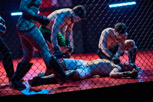 istock Accident during martial arts training. Helping knocked out fighter 1253460769