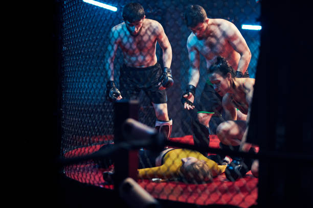 istock Accident during martial arts training. Helping knocked out fighter 1253461558