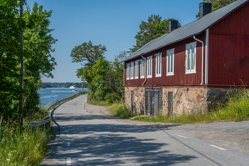 The old house on the side of the road. Rindo island near Vaxholm in Stockholm archipelago. Countryside photo. Sweden. Scandinavia