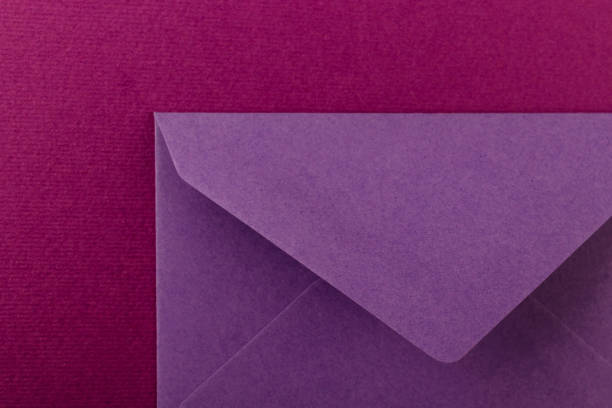 istock Colorful envelope on a purple background. 1253463216