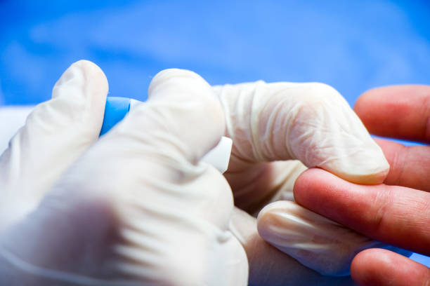 istock Insulin testing process, blood test and syringe. Injection in the hand. Patients and doctor. Studio shoot. 1253464167