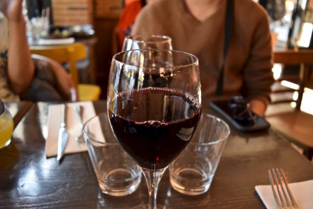 istock A grass of red wine at bistro. 1253464275
