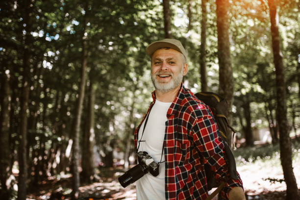 istock Mature man on a hiking trip through forest 1253465275