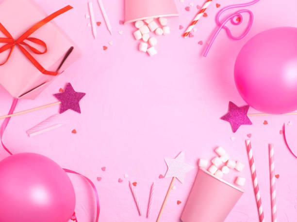 istock Birthday decorations with balloons, gift boxes, flowers, paper cups. 1253467039