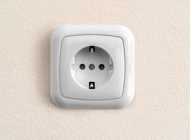 istock White european socket on renovated painted wall 1253467422