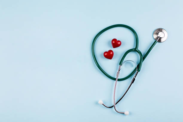 national nurse day holiday background. medical stethoscope, two red hearts. - national hero imagens e fotografias de stock