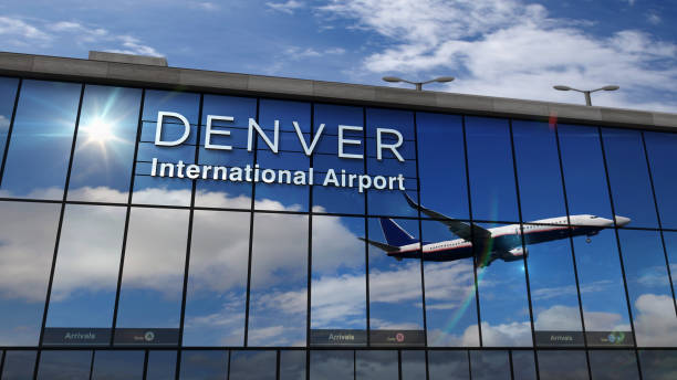 istock Airplane landing at Denver Colorado mirrored in terminal 1253472344