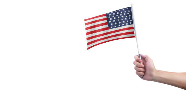 istock Hand holding american flag. usa flag in hand 1253472717