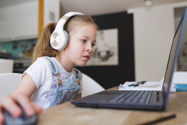 istock young girl with headphones and notebook 1253474369