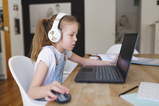 istock young girl with headphones and notebook 1253474889