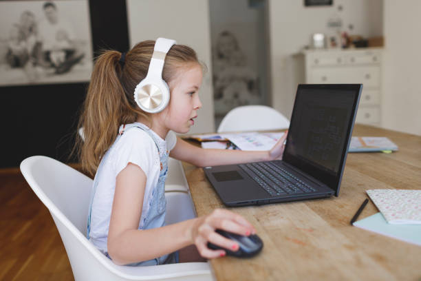 istock young girl with headphones and notebook 1253474918
