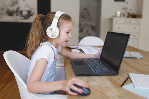 istock young girl with headphones and notebook 1253474938