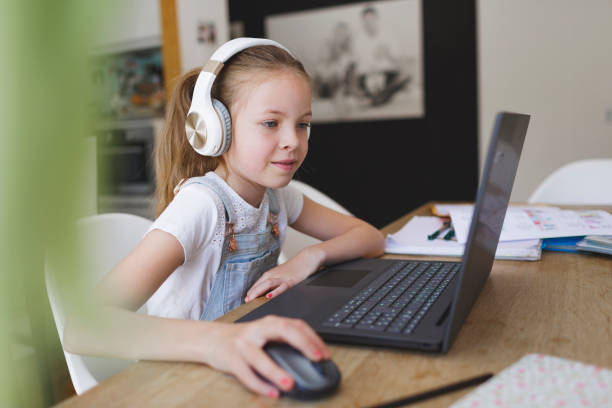 istock young girl with headphones and notebook 1253475449
