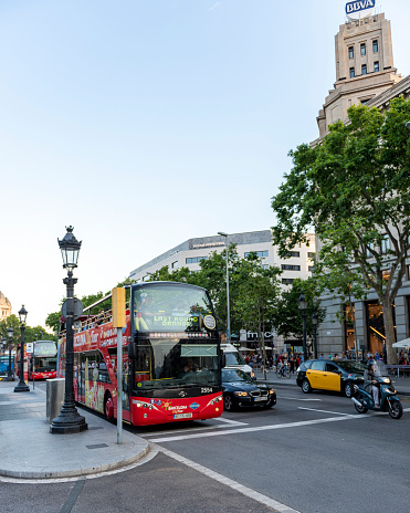 Barcelona, Spain - June 01, 2017: Tour bus waiting at bus stop in Plaza De Catalunya (Catalonia Square), Barcelona, Spain.