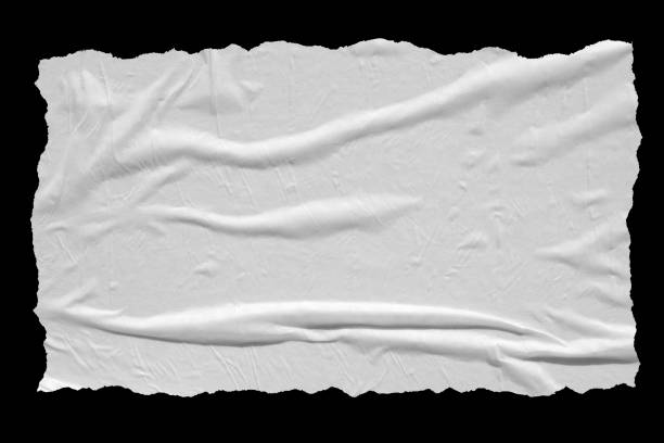 istock Torn crumpled paper sheet isolated on black background. 1253475623
