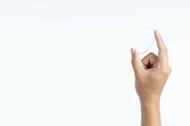 istock Hand holding transparent cosmetic silicone puff 1253477751