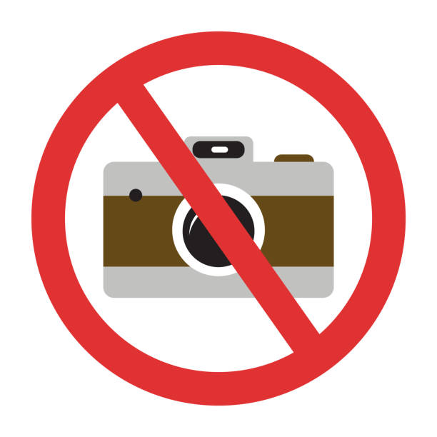 istock Photo camera forbidden. Banned camera crossed simple colorful icon. Not allowed to take a photos 1253478922