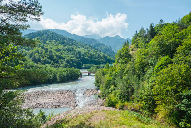 istock Summer landscape with river and mountain 1253480588