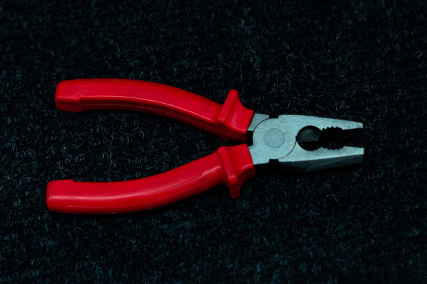istock Pliers tool on black background for metall works 1253482593
