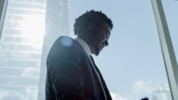 istock Businessman celebrating success. Office with a view 1253486485