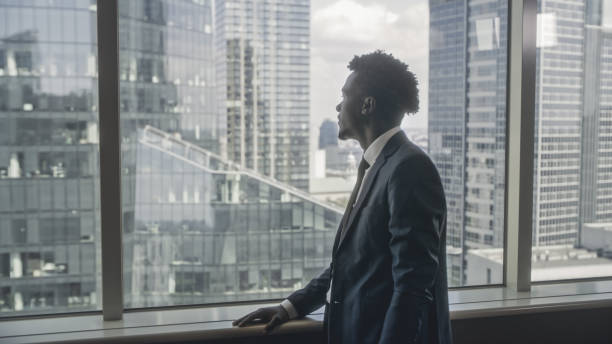istock Concentrated businessman portrait. Office with a view 1253486543