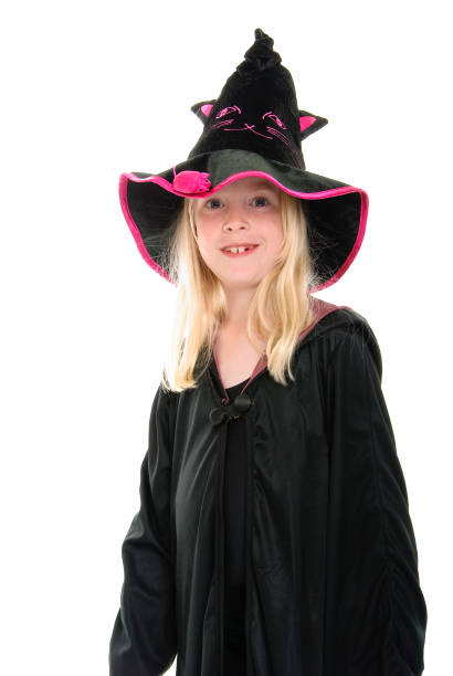 istock Pretty young blonde girl with missing teeth dressed as a witch for Halloween 1253487169