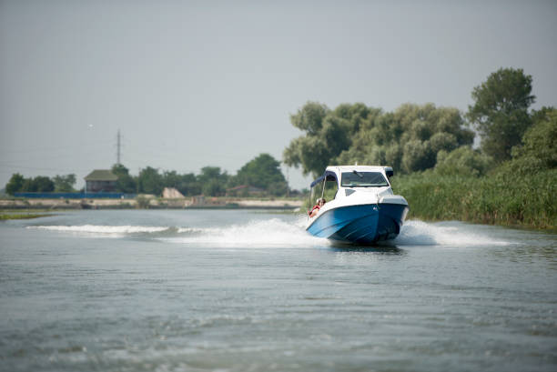 August 2016 - Boat on Danube river,  Danube delta area,  Romania,  in a sunny summer day; outdoors