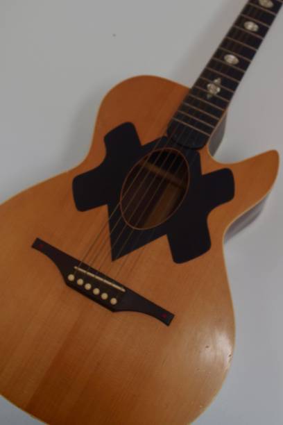istock Acoustic guitar and guitar strings 1253488394