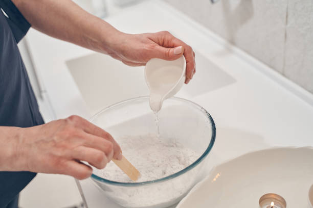 istock Preparing kaolin clay for beauty procedures in spa salon 1253490651
