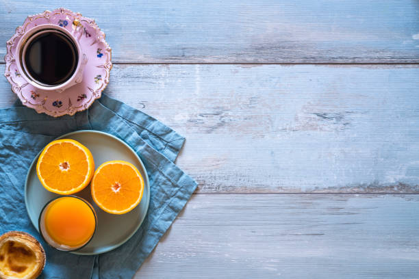 istock Breakfast Coffee with Portuguese egg tart with orange juice 1253490862