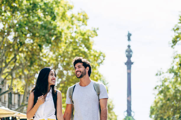 istock Weekend vacationers enjoying sunny Barcelona on foot 1253492000