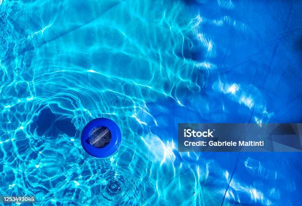 Floating Plastic Chlorine Dispenser And Blue Water Seen From Above Stock Photo - Download Image Now