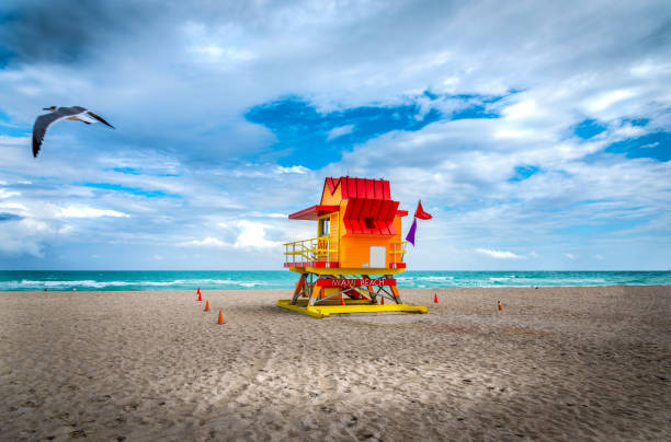 istock Cloudy sky over  a colorful lifeguard tower in Miami Beach 1253493139