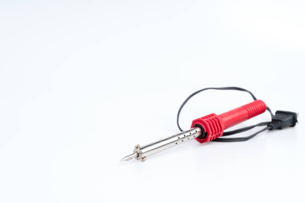 Soldering iron with a red handle for heating to melt solder in electronic equipment on white background