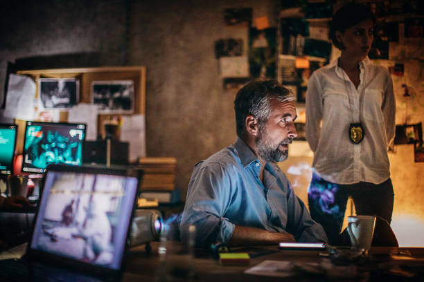 istock Two FBI agents working late 1253494238